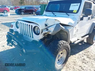 2005 Jeep Wrangler Unlimited with VIN 1J4FA44SX5P316055, listed as a IAAI auction lot 41586898 with 218,181 mi miles. Bid and sale history available at carsss.com. Image 6.