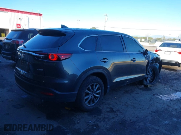 2018 Mazda CX-9 Sport z VIN JM3TCABY8J0203093, wystawiony jako IAAI lot #41218241 z przebiegiem 130 832 mil mil oraz . Historia ofert i sprzedaży dostępna na DreamBid. Obrazek 4.