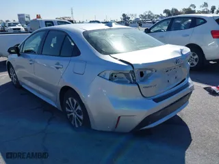 2020 Toyota Corolla Hybrid LE with VIN JTDEBRBE0LJ027338, listed as a IAAI auction lot 41721044 with 120,868 mi miles. Bid and sale history available at carsss.com. Image 3.
