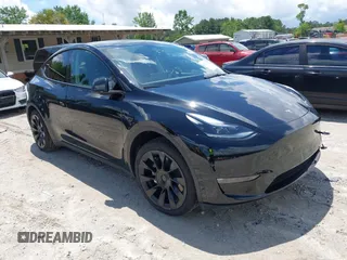 2023 Tesla Model Y Long Range with VIN 7SAYGAEE5PF878157, listed as a IAAI auction lot 42241219 with 17,804 mi miles and . Bid and sale history available at DreamBid. Image 1.