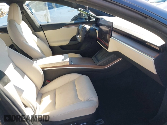 2023 Tesla Model S with VIN 5YJSA1E5XPF500341, listed as a IAAI auction lot 40756406 with 11,583 mi miles and . Bid and sale history available at DreamBid. Image 5.