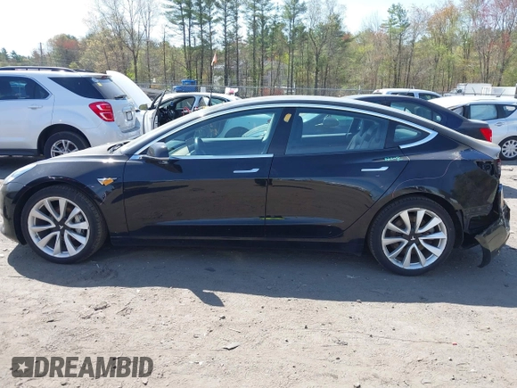 2018 Tesla Model 3 Long Range Battery z VIN 5YJ3E1EB6JF086612, wystawiony jako IAAI lot #42149440 z przebiegiem 101 170 mil mil oraz . Historia ofert i sprzedaży dostępna na DreamBid. Obrazek 14.