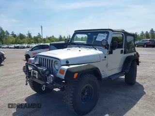 2003 Jeep Wrangler Sport z VIN 1J4FA49S73P302278, wystawiony jako IAAI lot #42219582 z przebiegiem 129 089 mil mil oraz . Historia ofert i sprzedaży dostępna na DreamBid. Obrazek 2.