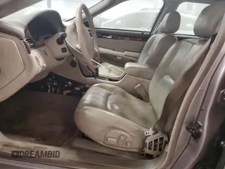 1998 Cadillac Seville STS z VIN 1G6KY5490WU916771, wystawiony jako Copart lot #58699555 z przebiegiem 129 944 mil mil oraz Nie do naprawy. Historia ofert i sprzedaży dostępna na DreamBid. Obrazek 7.