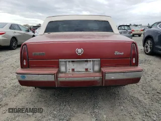 1986 Cadillac Eldorado z VIN 1G6EL5784GU616263, wystawiony jako Copart lot #48741325 z przebiegiem 59 213 mil mil oraz Tytuł czysty. Historia ofert i sprzedaży dostępna na DreamBid. Obrazek 6.