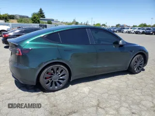 2022 Tesla Model Y Performance z VIN 7SAYGDEF2NF573979, wystawiony jako Copart lot #57778265 z przebiegiem 49 232 mil mil oraz Szkoda całkowita • Salvage title. Historia ofert i sprzedaży dostępna na DreamBid. Obrazek 3.
