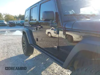 2015 Jeep Wrangler Unlimited Rubicon with VIN 1C4BJWFGXFL610153, listed as a IAAI auction lot 41575401 with 114,583 mi miles. Bid and sale history available at carsss.com. Image 6.