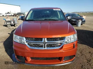 2013 Dodge Journey American Value with VIN 3C4PDCAB4DT590975, listed as a Copart auction lot 55627725 with 212,659 mi miles and Clean Title. Bid and sale history available at DreamBid. Image 5.