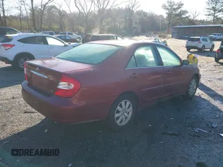 2004 Toyota Camry LE with VIN 4T1BF32K04U074049, listed as a IAAI auction lot 41768724 with 262,296 mi miles and . Bid and sale history available at DreamBid. Image 4.