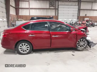 2019 Nissan Sentra S z VIN 3N1AB7AP7KY257283, wystawiony jako IAAI lot #42012338 z przebiegiem 103 503 mil mil oraz . Historia ofert i sprzedaży dostępna na DreamBid. Obrazek 14.