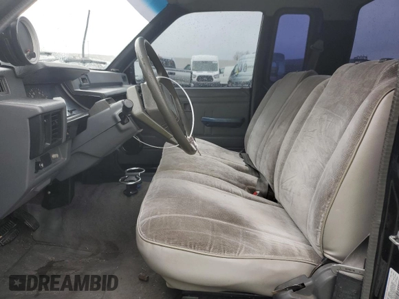 1991 Mitsubishi Mighty Max z VIN JA7FL25W7MP028365, wystawiony jako Copart lot #43964285 z przebiegiem 175 102 mil mil oraz Szkody całkowita. Historia ofert i sprzedaży dostępna na DreamBid. Obrazek 7.