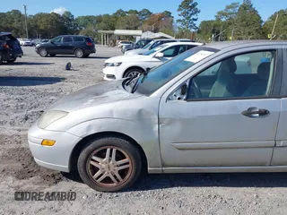 2003 Ford Focus SE z VIN 1FAFP34Z23W257426, wystawiony jako IAAI lot #40736207 z przebiegiem 87 447 mil mil oraz . Historia ofert i sprzedaży dostępna na DreamBid. Obrazek 6.