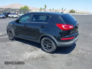 2013 Kia Sportage LX with VIN KNDPBCA25D7449584, listed as a IAAI auction lot 42489414 with 100,993 mi miles and . Bid and sale history available at DreamBid. Image 3.