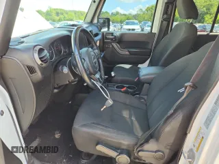 2015 Jeep Wrangler Unlimited Freedom with VIN 1C4HJWDGXFL755528, listed as a Copart auction lot 64927525 with 111,096 mi miles and Salvage title. Bid and sale history available at DreamBid. Image 7.