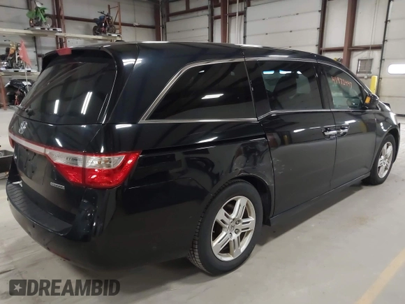2011 Honda Odyssey Touring with VIN 5FNRL5H9XBB055008, listed as a IAAI auction lot 41973447 with 218,762 mi miles and . Bid and sale history available at DreamBid. Image 4.