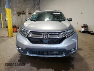 2018 Honda CR-V Touring z VIN 7FARW2H95JE012947, wystawiony jako Copart lot #64779925 z przebiegiem 20 561 mil mil oraz Szkoda całkowita • Salvage title. Historia ofert i sprzedaży dostępna na DreamBid. Obrazek 5.