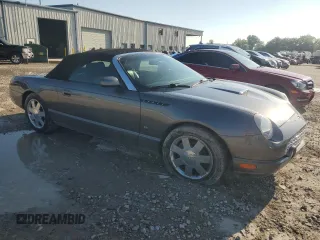 2003 Ford Thunderbird Deluxe z VIN 1FAHP60A63Y107026, wystawiony jako Copart lot #70650964 z przebiegiem 36 115 mil mil oraz Szkoda całkowita • Salvage title. Historia ofert i sprzedaży dostępna na DreamBid. Obrazek 4.