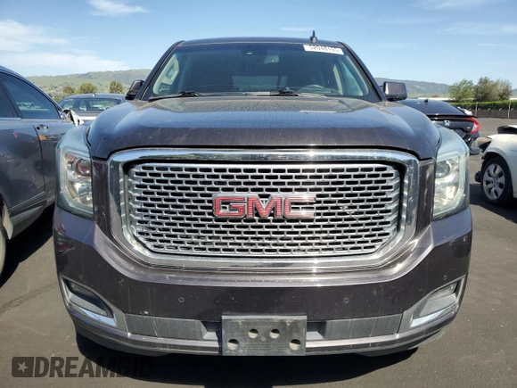 2015 GMC Yukon Denali with VIN 1GKS2CKJ8FR596848, listed as a Copart auction lot 52048105 with 129,935 mi miles and Salvage Title. Bid and sale history available at carsss.com. Image 5.