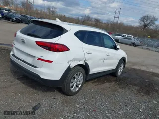 2019 Hyundai Tucson Value with VIN KM8J3CA42KU013032, listed as a IAAI auction lot 41880465 with 51,332 mi miles. Bid and sale history available at carsss.com. Image 4.