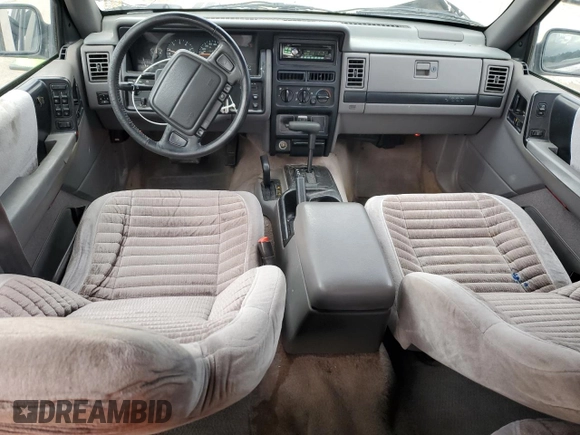 1995 Jeep Grand Cherokee Laredo with VIN 1J4GZ58S7SC517783, listed as a Copart auction lot 43057145 with 225,273 mi miles and Salvage Title. Bid and sale history available at carsss.com. Image 8.