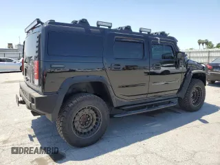 2005 Hummer H2 SUV z VIN 5GRGN23U05H117630, wystawiony jako Copart lot #57087305 z przebiegiem 60 260 mil mil oraz Szkoda całkowita • Salvage title. Historia ofert i sprzedaży dostępna na DreamBid. Obrazek 3.
