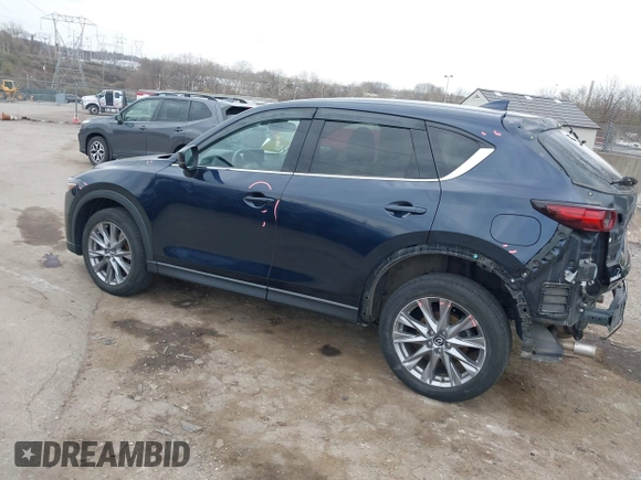 2021 Mazda CX-5 Grand Touring with VIN JM3KFADM0M1321375, listed as a IAAI auction lot 41913449 with 88,178 mi miles. Bid and sale history available at carsss.com. Image 3.
