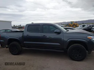 2022 Toyota Tacoma SR with VIN 3TYAX5GN8NT066318, listed as a IAAI auction lot 41739981 with 50,186 mi miles and . Bid and sale history available at DreamBid. Image 13.