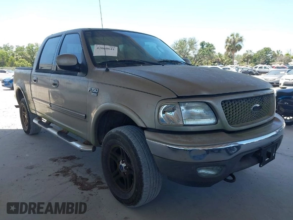 2002 Ford F-150 XLT with VIN 1FTRW08LX2KE43025, listed as a IAAI auction lot 42060641 with 123,507 mi miles. Bid and sale history available at carsss.com. Image 1.