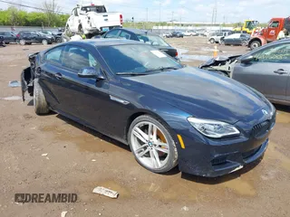 2017 BMW 6 Series 650i xDrive z VIN WBA6H7C57HGA05203, wystawiony jako IAAI lot #42013232 z przebiegiem 77 355 mil mil oraz . Historia ofert i sprzedaży dostępna na DreamBid. Obrazek 1.