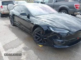 2022 Tesla Model S Plaid with VIN 5YJSA1E60NF460244, listed as a IAAI auction lot 41996403 with Not provided miles and . Bid and sale history available at DreamBid. Image 6.