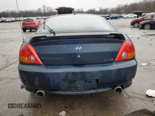 2003 Hyundai Tiburon GT z VIN KMHHN65F13U068658, wystawiony jako Copart lot #81799404 z przebiegiem 163 148 mil mil oraz Szkoda całkowita • Salvage title. Historia ofert i sprzedaży dostępna na DreamBid. Obrazek 6.