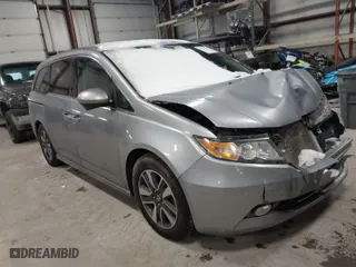 2016 Honda Odyssey Touring Elite with VIN 5FNRL5H98GB033189, listed as a IAAI auction lot 41544309 with 102,836 mi miles. Bid and sale history available at carsss.com. Image 1.