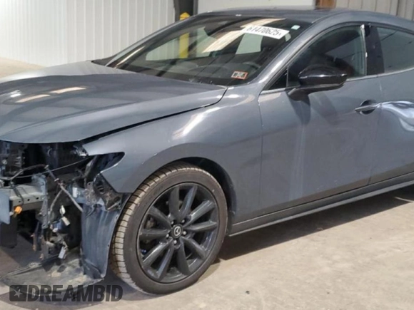 2021 Mazda 3 Premium Plus with VIN JM1BPBNYXM1311594, listed as a Copart auction lot 61470625 with 89,254 mi miles and Salvage title. Bid and sale history available at DreamBid. Image 1.