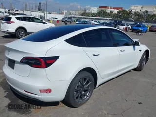 2023 Tesla Model 3 z VIN 5YJ3E1EA2PF514871, wystawiony jako IAAI lot #41703073 z przebiegiem 21 227 mil mil oraz . Historia ofert i sprzedaży dostępna na DreamBid. Obrazek 4.