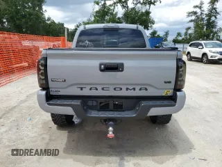 2020 Toyota Tacoma SR5 z VIN 3TMAZ5CN0LM115004, wystawiony jako Copart lot #55343295 z przebiegiem 82 865 mil mil oraz Nie do naprawy • Non repairable. Historia ofert i sprzedaży dostępna na DreamBid. Obrazek 6.