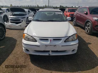 1999 Pontiac Grand Am GT with VIN 1G2NW12E0XM853038, listed as a Copart auction lot 69262194 with 162,986 mi miles and Salvage Title. Bid and sale history available at carsss.com. Image 5.