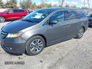 2016 Honda Odyssey Touring Elite with VIN 5FNRL5H90GB128006, listed as a IAAI auction lot 41695438 with 133,337 mi miles. Bid and sale history available at carsss.com. Image 2.