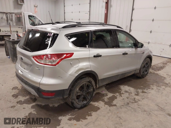 2014 Ford Escape SE z VIN 1FMCU9GX1EUD67624, wystawiony jako IAAI lot #41986362 z przebiegiem 79 921 mil mil oraz . Historia ofert i sprzedaży dostępna na DreamBid. Obrazek 4.