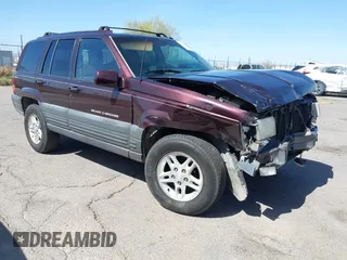 1996 Jeep Grand Cherokee Laredo with VIN 1J4GZ58S3TC391942, listed as a IAAI auction lot 41711778 with 202,765 mi miles. Bid and sale history available at carsss.com. Image 1.