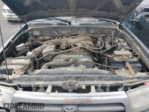 1997 Toyota 4Runner SR5 z VIN JT3HN86R9V0059388, wystawiony jako Copart lot #59231815 z przebiegiem 310 270 mil mil oraz Szkoda całkowita • Salvage title. Historia ofert i sprzedaży dostępna na DreamBid. Obrazek 12.