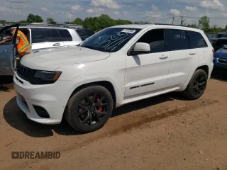 2018 Jeep Grand Cherokee with VIN NJ1449E, listed as a Copart auction lot 51357834 with 32,619 mi miles and Salvage title. Bid and sale history available at DreamBid. Image 1.