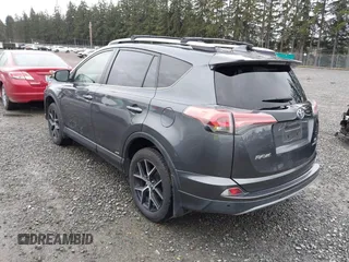 2018 Toyota RAV4 Hybrid SE with VIN JTMJJREV7JD208249, listed as a IAAI auction lot 41859301 with 91,899 mi miles and . Bid and sale history available at DreamBid. Image 3.