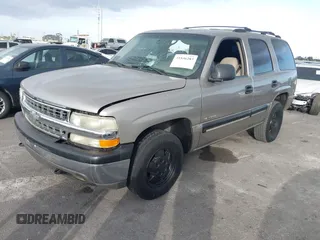 2001 Chevrolet Tahoe LS z VIN 1GNEC13T71R199027, wystawiony jako IAAI lot #41546283 z przebiegiem 232 905 mil mil oraz . Historia ofert i sprzedaży dostępna na DreamBid. Obrazek 2.