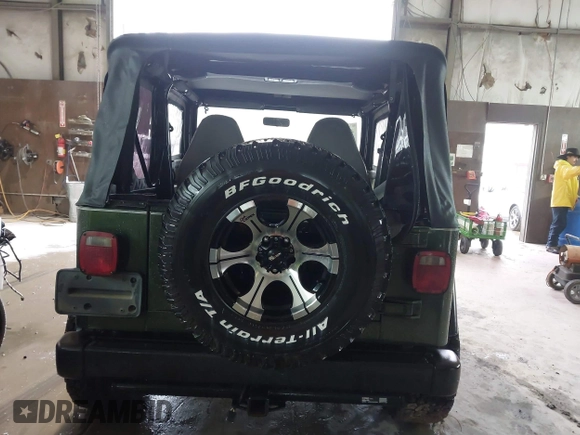 1998 Jeep Wrangler SE with VIN 1J4FY29P2WP733255, listed as a IAAI auction lot 41554602 with 157,316 mi miles. Bid and sale history available at carsss.com. Image 16.