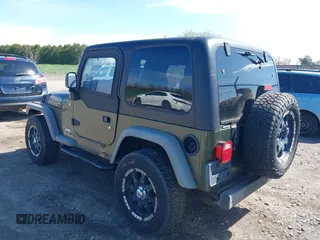 2006 Jeep Wrangler SE with VIN 1J4FA29116P763914, listed as a IAAI auction lot 42140140 with 107,161 mi miles. Bid and sale history available at carsss.com. Image 3.