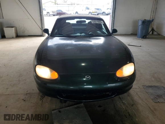 1999 Mazda MX-5 Miata z VIN JM1NB353XX0111850, wystawiony jako Copart lot #53076805 z przebiegiem 128 707 mil mil oraz Szkoda całkowita • Salvage title. Historia ofert i sprzedaży dostępna na DreamBid. Obrazek 5.