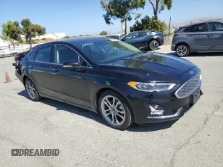 2020 Ford Fusion Titanium z VIN 3FA6P0RU3LR231920, wystawiony jako Copart lot #61643035 z przebiegiem 55 855 mil mil oraz Szkoda całkowita • Salvage title. Historia ofert i sprzedaży dostępna na DreamBid. Obrazek 4.