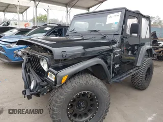 2002 Jeep Wrangler Sport with VIN 1J4FA49S02P705470, listed as a IAAI auction lot 42477770 with 59,395 mi miles and . Bid and sale history available at DreamBid. Image 2.