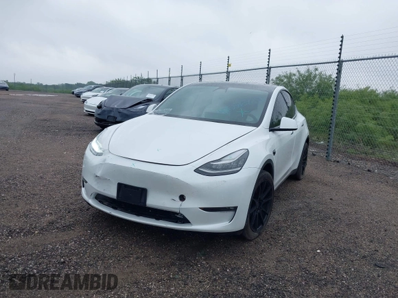2022 Tesla Model Y Long Range z VIN 7SAYGDEE3NF426481, wystawiony jako IAAI lot #42076729 z przebiegiem 21 648 mil mil oraz . Historia ofert i sprzedaży dostępna na DreamBid. Obrazek 20.
