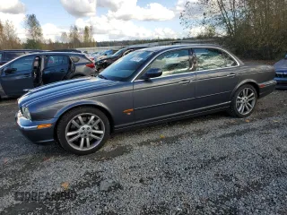 2005 Jaguar XJ with VIN SAJWA73B05TG40023, listed as a Copart auction lot 73163814 with 95,818 mi miles and Salvage Title. Bid and sale history available at carsss.com. Image 1.